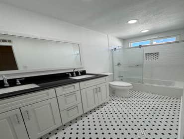 Photos by Apex Designer & Builder #1 Master bathroom and a bathroom remodeled