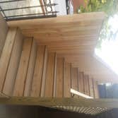 Deck Upgrade Existing structure was not constructed to code and was failing, new pressure treated lumber frame with cedar finish and aluminum rail to c