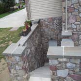 moore job this is outside stairs, seating area, sunk in play area with fire pit. intertaining area