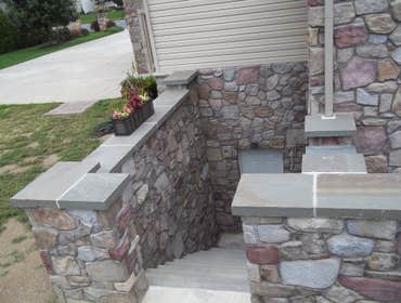 moore job this is outside stairs, seating area, sunk in play area with fire pit. intertaining area