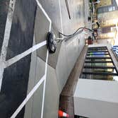 Photos by Metro Sealcoating/striping LLC #3 Restripe existing parking stalls, Pressure wash & Sanitized all hand rail and sidewalks and 3 staircases th