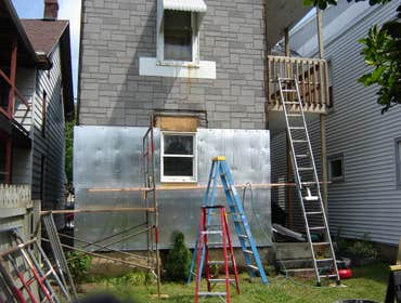 Swank Home Makeover A 2.5 story, single-family home: Siding, windows, insullation, soffit, fascia, capping. Also, repaired fence damage, installed new