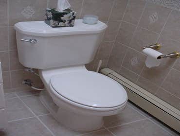 bathroom Bathroom remodel including shower, tile, toilet, cabinets, sink/counter, heated floor, lighting
