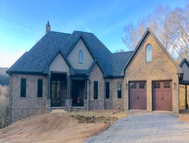 Photos by Thomas Elliott #1 2100 sf home with partially finished pre-cast concrete basement. This home has wood flooring, custom woodwork, tile and cab