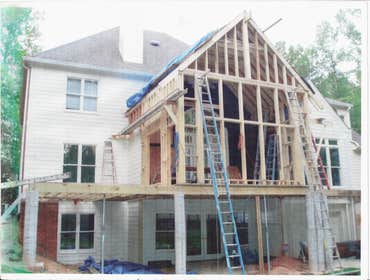 Photo(s) from Home Renovations & Remodeling Wall of windows great room addition, deck & cypress porch with stone water fall, pond & patio