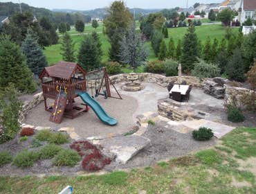 moore job this is outside stairs, seating area, sunk in play area with fire pit. intertaining area