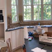 Photos by Top Floor Home Restorations #4 Installing new antique brick as this customers new back splash. This photos are in middle of project brick ha