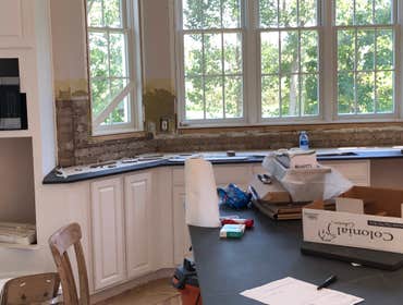 Photos by Top Floor Home Restorations #4 Installing new antique brick as this customers new back splash. This photos are in middle of project brick ha