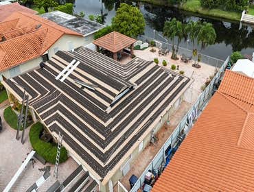 Photos by Gold Star Miami Corp #1 metal roof panels all are . 25 years warrantee