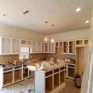 Photos by From the Ground Up #7 Refaced kitchen cabinets and painted. Also installed recess lighting .