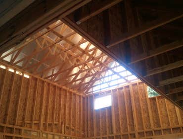 Garage Design and Build Our client wanted a large garage and porch designed to match the style of their home.