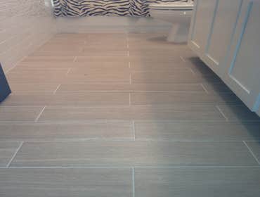 Complete Bathroom Remodel Tiled floors, tiled walls, Custom made vanity, Replace counter top with granite, Tiled bath area, and painted walls