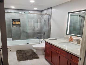 Michaels Bathroom San jose Full bathroom gut out. New shower tile with new plumbing in shower and vanity. All new textured walls. custom shower doors a