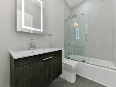 Photos by Urbanity Homes #1 Maverick St Boston MA
The Maverick Street condos are a study in materials. Simple geometries are given interest with contra