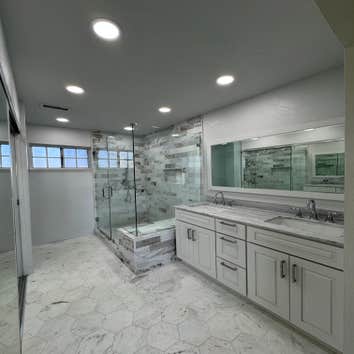 Photos by Apex Designer & Builder #1 Master bathroom and a bathroom remodeled