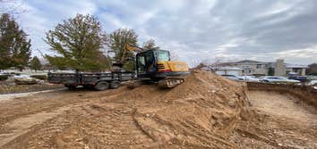 Photos by Asap Inc Replacement Septic System, Trenches being dug out.