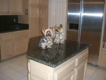 Kitchen Remodeling in H.B. Ca We replaced the Kitchen tiles , also put new granite counter tops and bathroom counter tops.