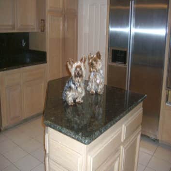 Kitchen Remodeling in H.B. Ca We replaced the Kitchen tiles , also put new granite counter tops and bathroom counter tops.