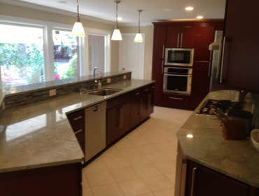Villa Cherry RTA kitchen cabinets This project used Villa Cherry kitchen cabinets, Caribbean Green Granite, Shimmering Light Glass Tile for Back Splash