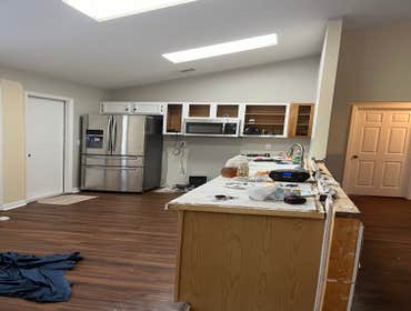 Photos by Tropical Building & Remodeling Inc #1 Completely removed old kitchen and end pony wall. Cut down pony wall to cabinet height and installed ro