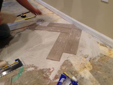 Photos by Modern Renovations #1 Tiled 1st Level with A Herringbone Pattern