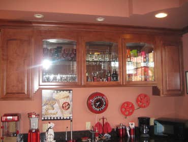 Custom Home Theatre and Bar located in La Canada, California Custom made maple cabinetry was utilized in this custom home theatre and bar located in L