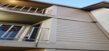 Photos by Verified Roofing LLC #2 Remove deteriorated siding, repair framing, install vapor barrier and new fiber cement lap siding.