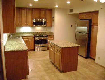 Photos by Frei Remodeling and Construction, LLC #2 Complete kitchen renovation. Demo existing walls. Installed new tile flooring, cabinet and granite c