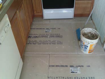 Photo(s) from Laur Moor Construction Two decks and a tiled kitchen floor