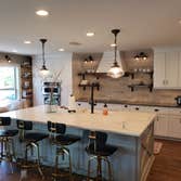 Photos by Jmc Builders Group LLC #1 Complete tear out and remodel with white shaker cabinets , custom oak shelving and bench