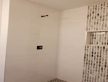 Ceramic tile shower with a vertical accent strip, Eagan, MN