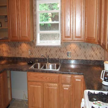 Kitchen Turned a kitchen in Carnegie from a very cold room to a room where true conversations can take place as well as preparing great food. There are