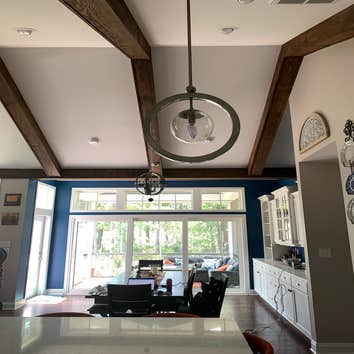 Fan Install- Modern New Construction Homes Installation of a non-standard fan in a new construction home. Installation of light fixtures.