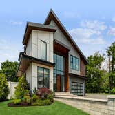 Home Construction Homes, inanimate though they may be, welcome differently. For this contemporary, the greeting comes in the form of an apron of paving