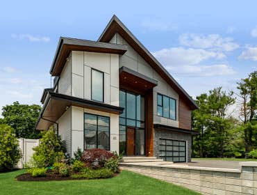 Home Construction Homes, inanimate though they may be, welcome differently. For this contemporary, the greeting comes in the form of an apron of paving