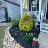 Photos by Lawn Frogs Landscaping #3 Dry creek bed with a French drain and drain pipe.