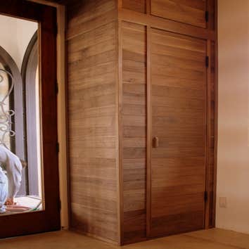 Legacy Cellars Inc Project Walnut wine cellar with custom bottle panel display, and cedar cigar humidor