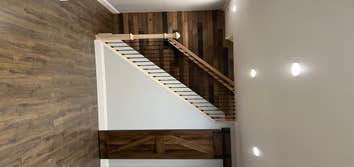 Photos by Sterling & Kole Realty LLC #2 Flooring, crown moulding, steps, post and beam, railings, banisters, wooden wall tile, install 7 doors, install