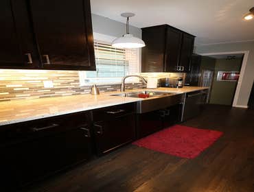 Minneapolis Multi-Room Remodel The scope of work included the entire kitchen & bathroom as well as flooring throughout the house & several additional i
