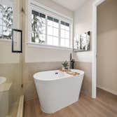 Photos by Certified Builders Inc #5 Steam shower, heated floors, back lit mirrors, heated towel rack, hidden tv, rain shower, custom niche, beautiful s