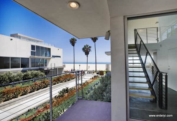 Apartment and condo buildings 10 unit mixed use condo building over a 2-story concrete subterranean garage. This modern building sitting right on the 