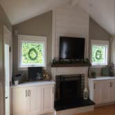Trim & Wainscoting Applied wainscoting to entry and hall. Trimmed out windows and doors along with shiplap above fireplace mantle.
