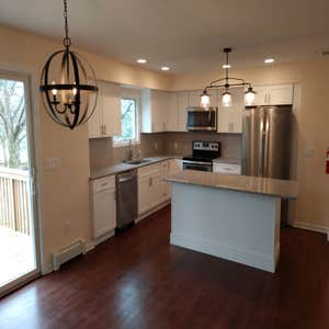 Kitchen Removed load bearing wall to create open concept.