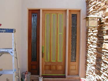Entry door refinishing The entry door was stripped by drawscraping. No chemicals were used in the removal of the old finish. A satin finish was applied