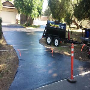 Apshalt Driveway Sealcoat This asphalt was allowed to cure for 1 year prior to sealcoating.