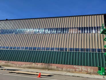 Photos by Nailed It Construction LLC #1 New metal siding on the UFP building in