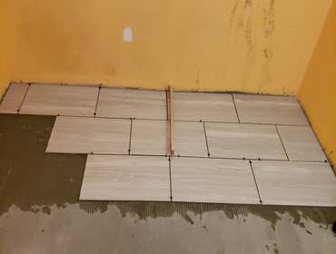 Tile job 2019 Kitchen floor remodel was vinyl to tile.