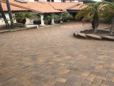 Photos by Pavers by Coyote, Inc #2 installation of paver driveway, retaining walls & concrete swales