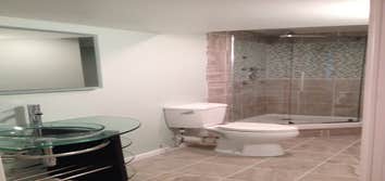Built New Bathroom in Basement High End Bathroom Build. Shower includes multi jet body sprays and multi color lighted rain shower. Herringbone patter