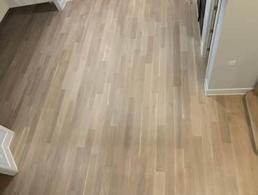 Photos by General Hardwood Flooring Inc #1 White oak 5”x3/4 installed, sanded and refinished with custom stain color
